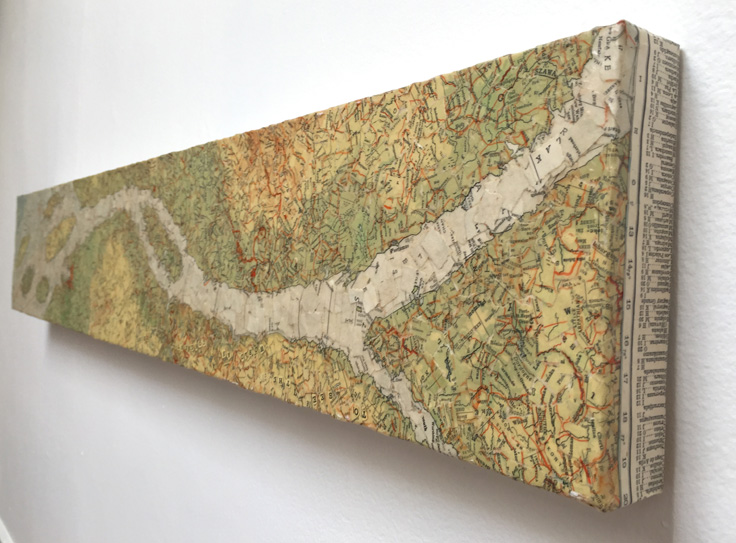 Torn map collage on canvas.  6 x 36 x 2 in.